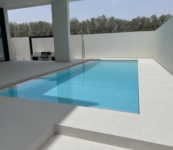 Elegant swimming pool with a minimalist design and clear blue water